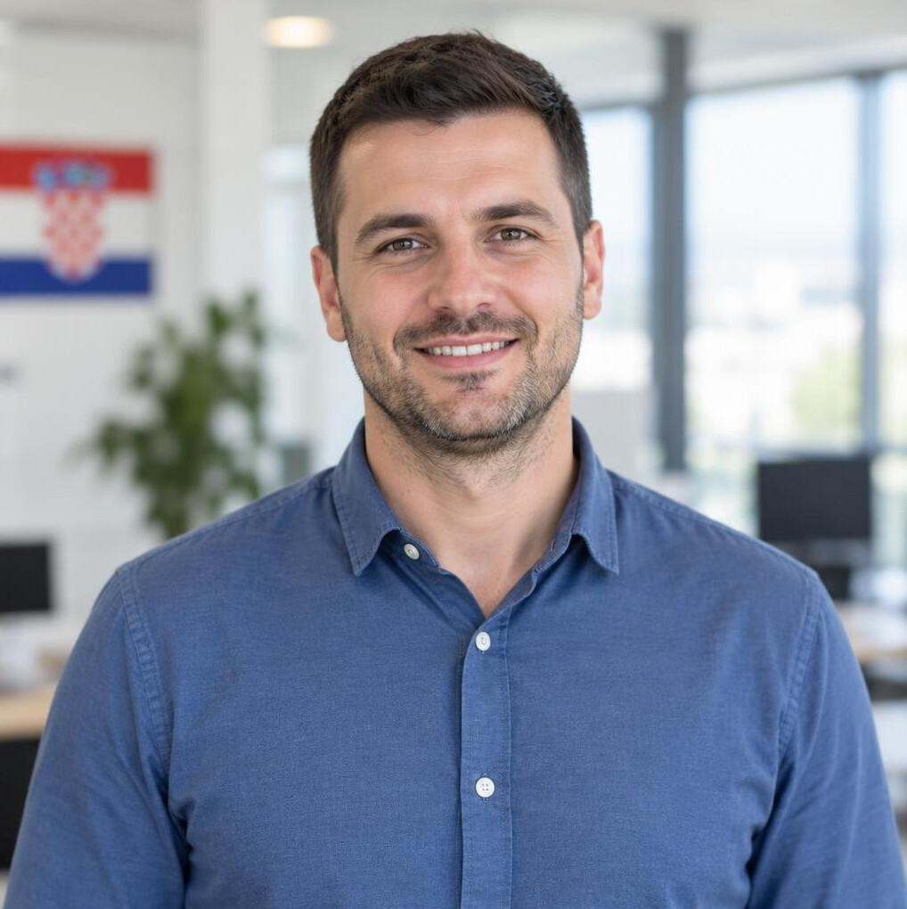 Portrait of a smiling man with short dark hair