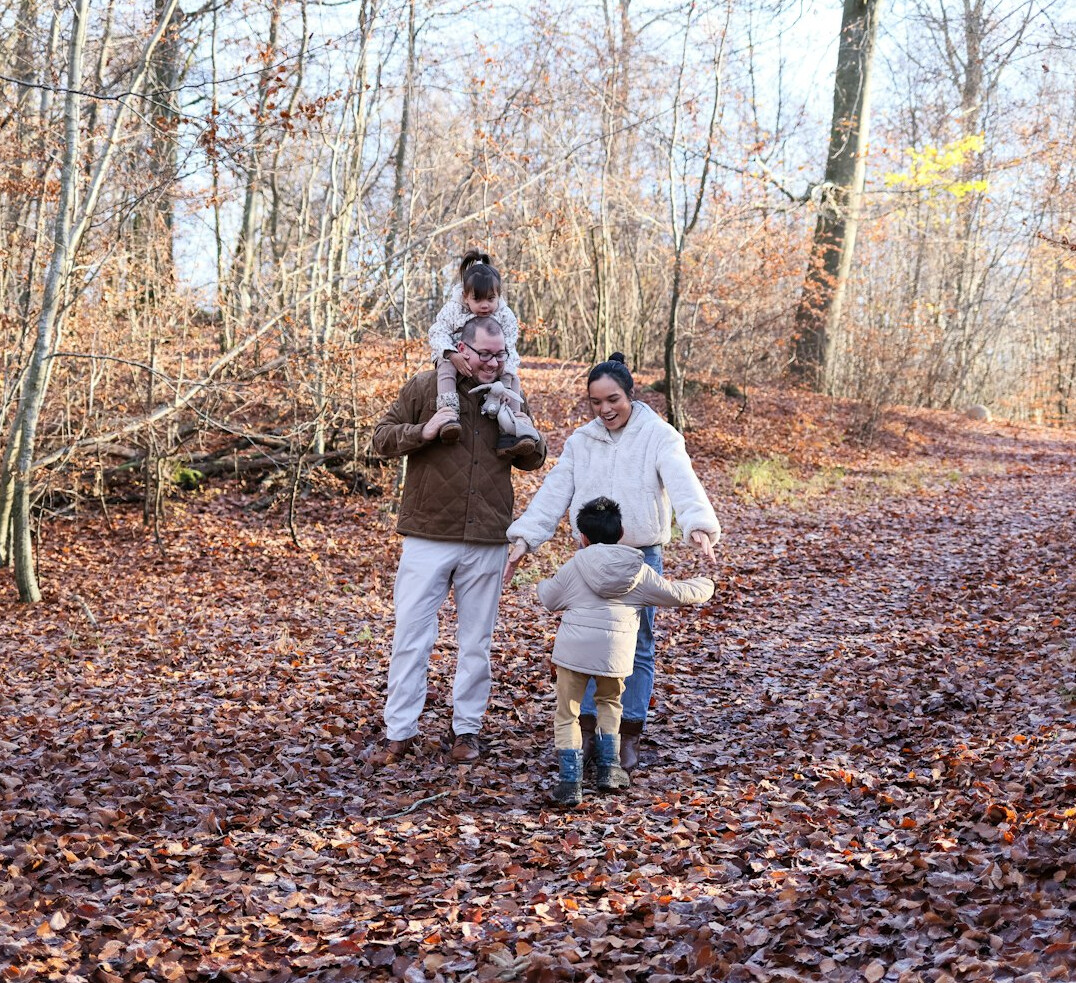 Happy family walking together outdoors